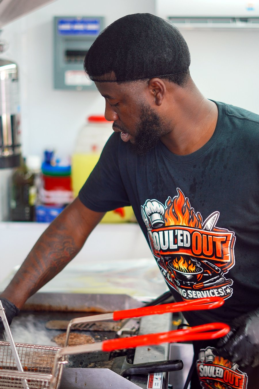 Demarquis cooking on the grill